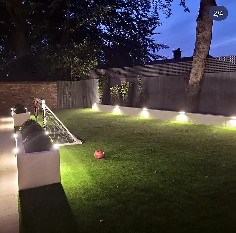 Garden wall and pathway lighting at dusk