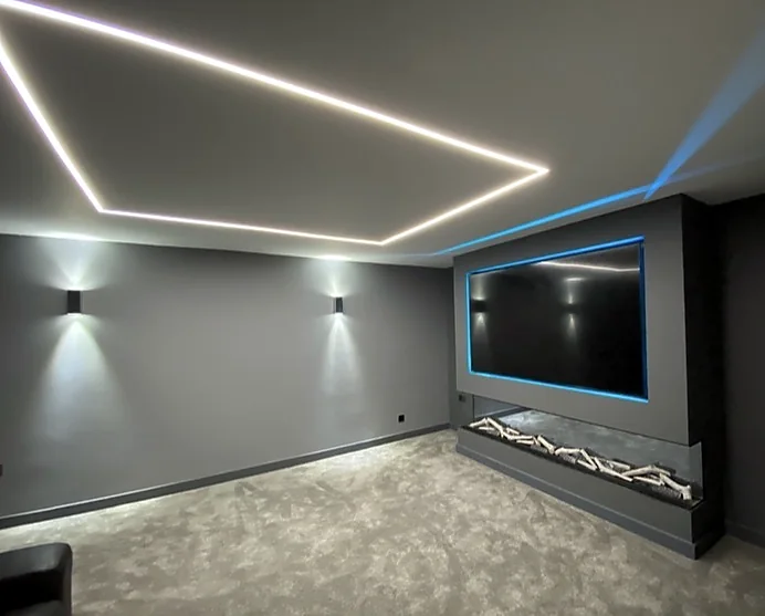 Media room with geometric LED ceiling lighting